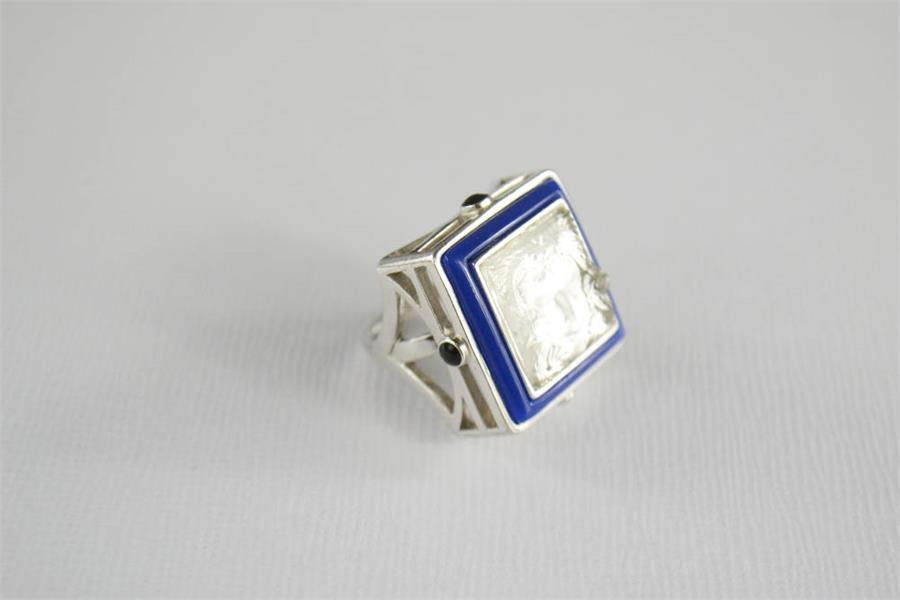 A Lalique Art Deco silver and crystal Masque Du Femme ring, bordered by blue enamel piping with - Image 8 of 9