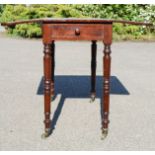 A 19th century mahogany Pembroke table with single drawer, two drop leaves, turned legs.