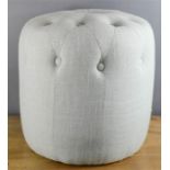 A buttoned foot stool in duck egg blue. 41cm high