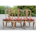 Three giltwood throne chairs.