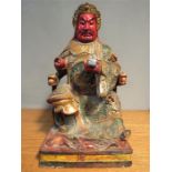 A Chinese gilt and polychrome carving of a deity, 43cm high.