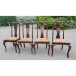 A set of four late 19th century dining chairs, with splat backs and cabriole legs.