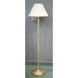 A brass standard lamp with adjustable arm, 152cm.