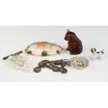 An amber glass model of a dog, a brooch in the form of glass grapes, a clam shell form purse, a