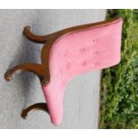 A Victorian mahogany nursing chair with pink upholstered button back.