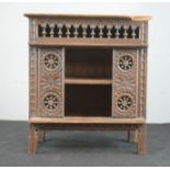 An apprentice piece 17th century style oak buffet, with spindled upper rail, roundels to the front