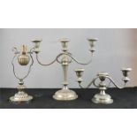Two silver plated candleabra and a gimble mounted table lamp.