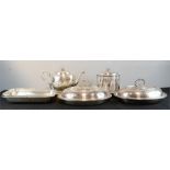 A group of silver plate lidded tureens, a Victorian silver plated tea caddy, a teapot, kettle stand,