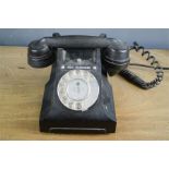 A black Bakelite phone.