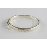 A silver child's bangle, maker GJ.