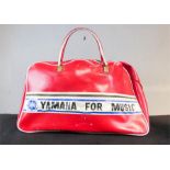 A Vintage Yamaha for Music holdall in red.