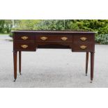 A 19th century mahogany serpentine fronted writing table, with three drawers to the front, and