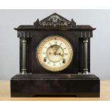A slate mantle clock, with Roman Numeral dial, 12cm high.