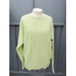 A green Lord jumper, size 44, with 75% merino wool.