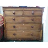 A Victorian mahogany chest of drawers, two short over three long graduated drawers, with turned