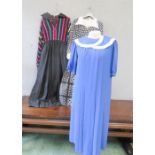 A blue Parigi dress, size 8, a black and white Dollyrockers designed by Sambo, and a size 14