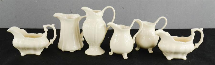 An Early 20th century assorted cream ware milk and cream jugs.