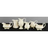An Early 20th century assorted cream ware milk and cream jugs.