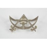 A vintage Ola Gorie sterling silver 'Masonic' crescent brooch.