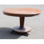 A Victorian mahogany centre table, with faceted column and lappet collar to the base.