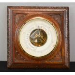 An oak cased wall barometer.