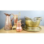 A group of copper and brassware including a coal bucket, jugs and tray.