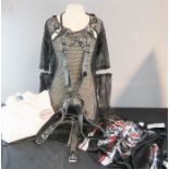 A group of bondage outfits including a cat suit.