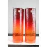 Blenko; a pair of glass hurricane lamps, crackled finish in red-orange, 31cm high.