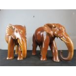 A pair of treen elephants, polished finish. 35cm high