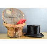 A Victorian top hat and original case, by Jones & Dunn. the top hat measures 52cm approx.