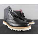 A pair of Ferranama black gents shoes, with fur lining, made in Italy, size 7.