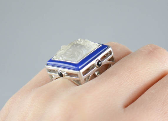 A Lalique Art Deco silver and crystal Masque Du Femme ring, bordered by blue enamel piping with - Image 9 of 9