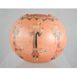 A signed vintage Navajo hand decorated red clay pot, 11cm high.