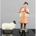 A Royal Doulton Lambing Time HN1890 21cm high, together with a Beswick sheep.