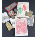 A selection of WWII Italian military insignia and paperwork.