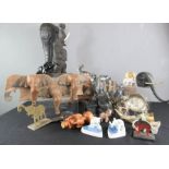 A quantity of various model elephant carvings, including wall plaque, ceramic examples and others.