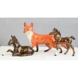 Two Beswick horses and a fox.