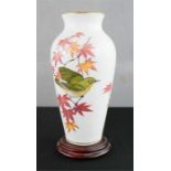 A Franklin Mint vase with base, 30cm high.