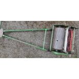 A Greens 1950s lawn mower and roller.