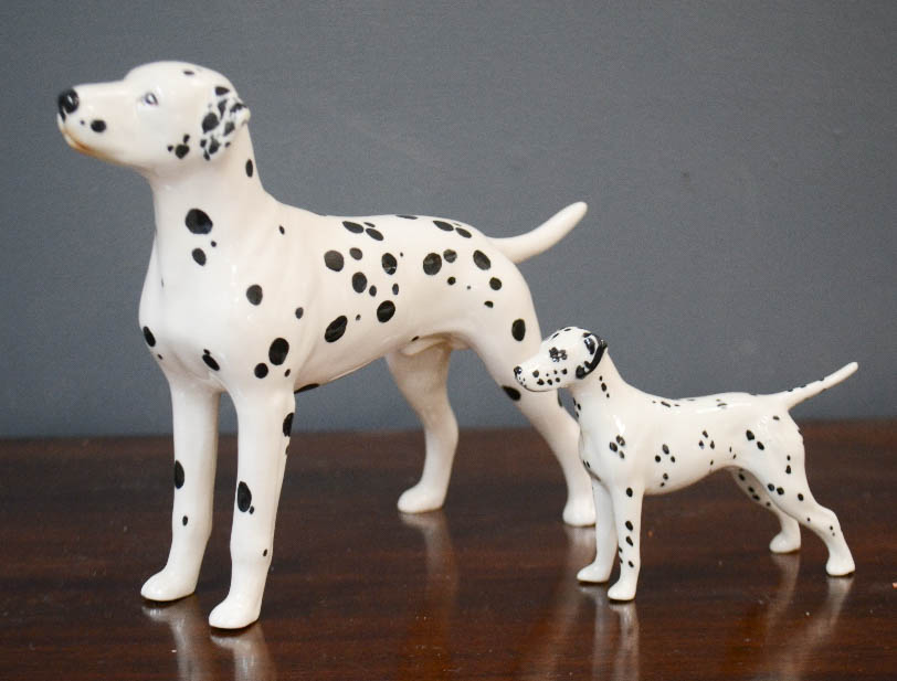 Two Beswick Dalmatians.