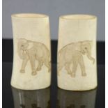 A 19th century pair of ivory carvings, depicting elephants. 9½cm high.