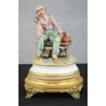 A Capo Di Monte figure of a tramp on a bench, raised on a gilt metal stand.