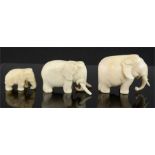 Three small 19th century carved ivory elephants. 4cm high.