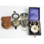 A Lawrence & Mayo of London Mark compass with mother of pearl dial, a further antique compass and