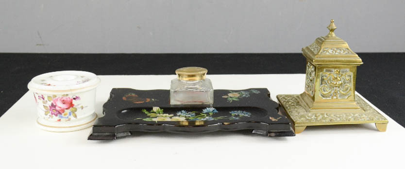 A black lacquered and decoupage inkwell together with a brass inkwell and a 19th century ceramic