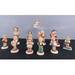 A group of Goebel figurines, numbered 95, 200/0, 1, 2052, 47/3, 123, 1997, 2050, 2077, 804.
