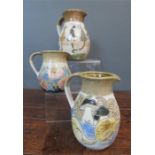 M&J Mosse of Llanbrynnair (20th century, Welsh): three pottery jugs; cats, squirrels, flowers