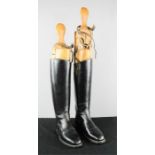 A pair of tree boots and riding boots, size 4 ladies.