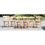 A set of eight pine kitchen chairs including two carvers.