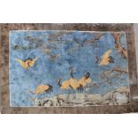 A Hanghai Silk rug, 4ft by 6ft, depicting cranes.